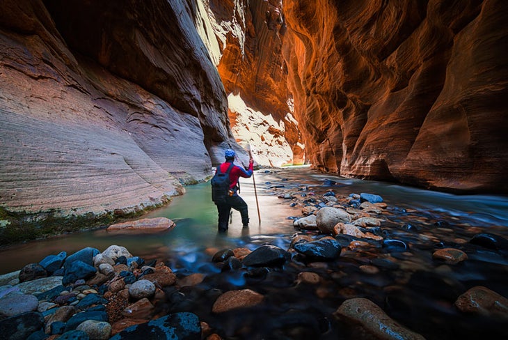 Z-Narrows-Wall-Street-hiker_TamSaurabhRay_800 A hiker approaches Wall Street in the Zion Narrow