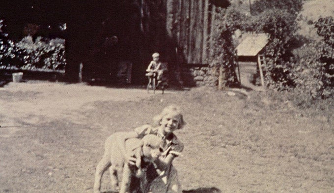 Capitol-Reef-Twilla-Gifford-wLamb_NPS-PD_680 Twilla Gifford with her lamb outside of the Gifford Homestead. Photo courtesy of NPS