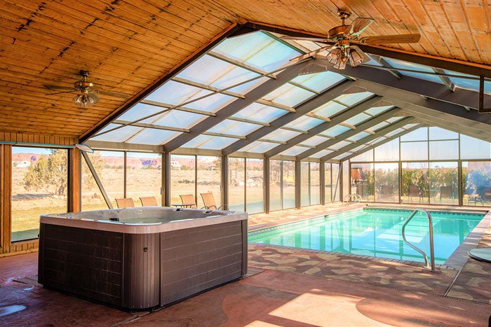 Broken-Spur-Pool-and-Hot-Tub_courtesy_700 Glass-ceiling pool house with hot tub at Broken Spur Inn in Torrey, Utah