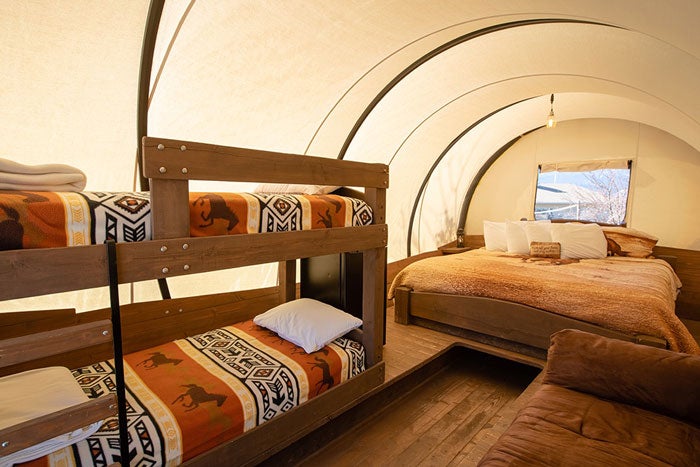 BrokenSpur-Conestoga-Wagon-Interior-Bunk-Bed_courtesy_700 Conestoga wagon with bunk beds at the Broken Spur Inn in Torrey, Utah