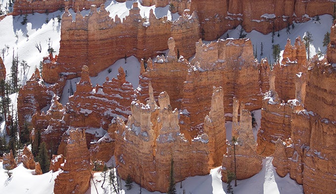 Bryce-hoodoos-winter_DP_680 Hoodoos poke out of snow at Bryce Canyon National Park.