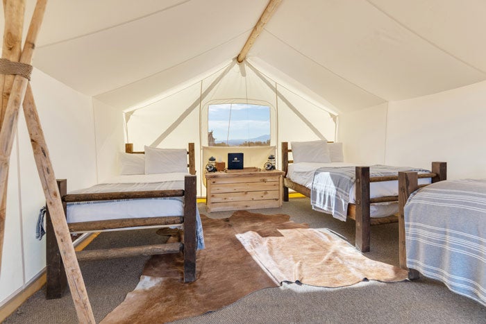 UnderCanvas-Moab-15_BaileyMade_MintStudioSD_courtesy_700 Tent with 3 single beds at Under Canvas Moab