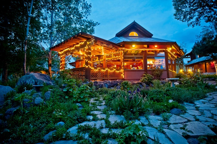 Hell's Backbone Grill in Escalante, Utah lit up at evening.