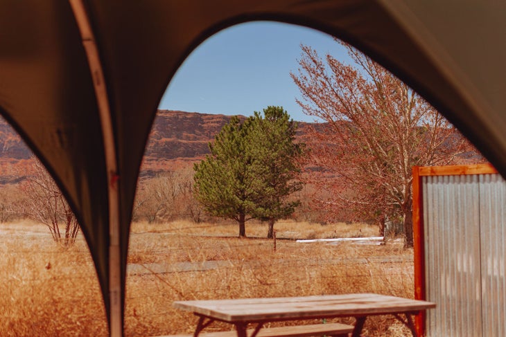 Peering out from a shade awning at Slickrock Campground in Moab by Sun RV Resorts