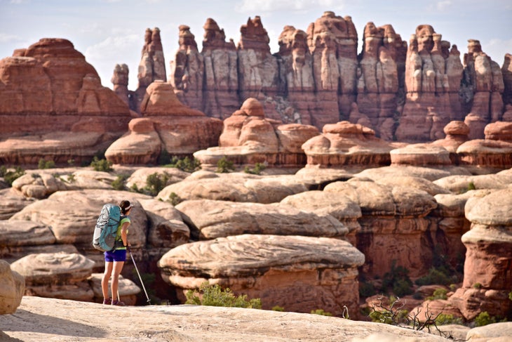 Hiker on Chesler Park Trail in the Needles region of Canyonlands National Park