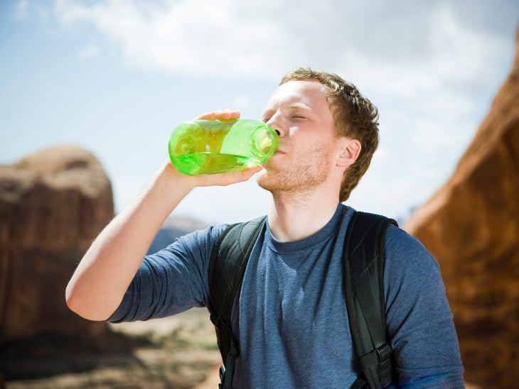Man drinking water in the Utah desert