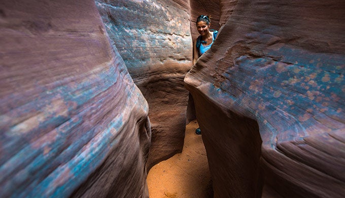 UT-GrandStaircaseEscalante-SpookyGulch-hiker_DP_680 A hiker in Spooky Gulch in Grand Staircase Escalente National Monument