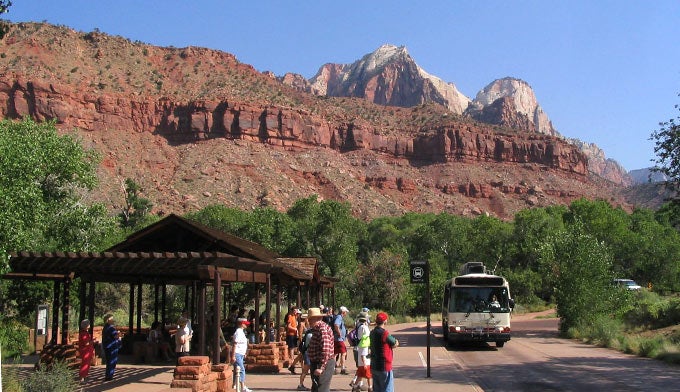 Zion-Visitor-Center-Shuttle_FlickrKenLund_680 Park visitors waiting for the shuttle at the Zion Canyon Visitors Center.